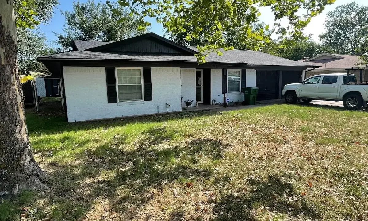 Professional roofing crew working on a residential roof in Wheaton